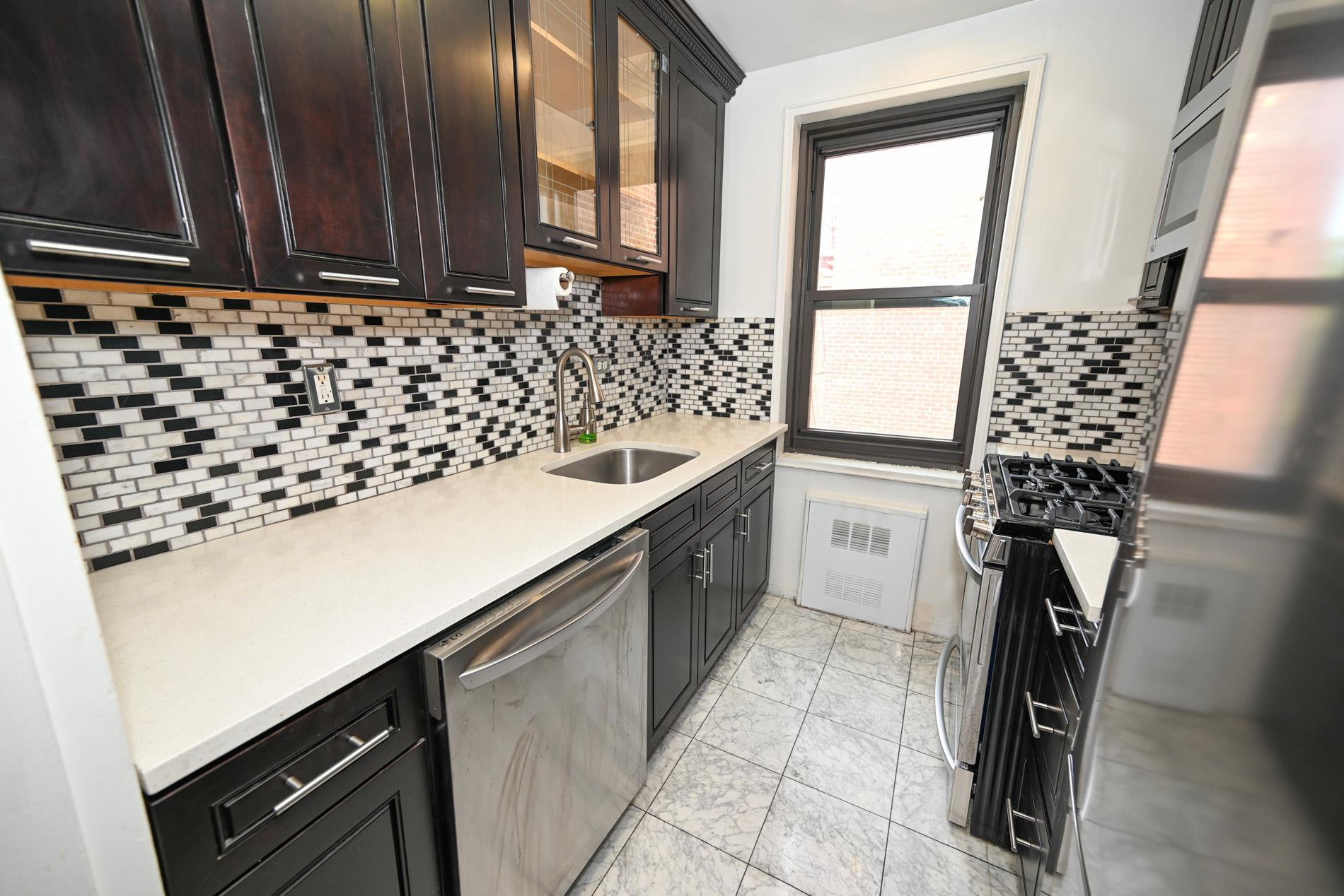 84-01 Main St # 410, Briarwood, NY 11435