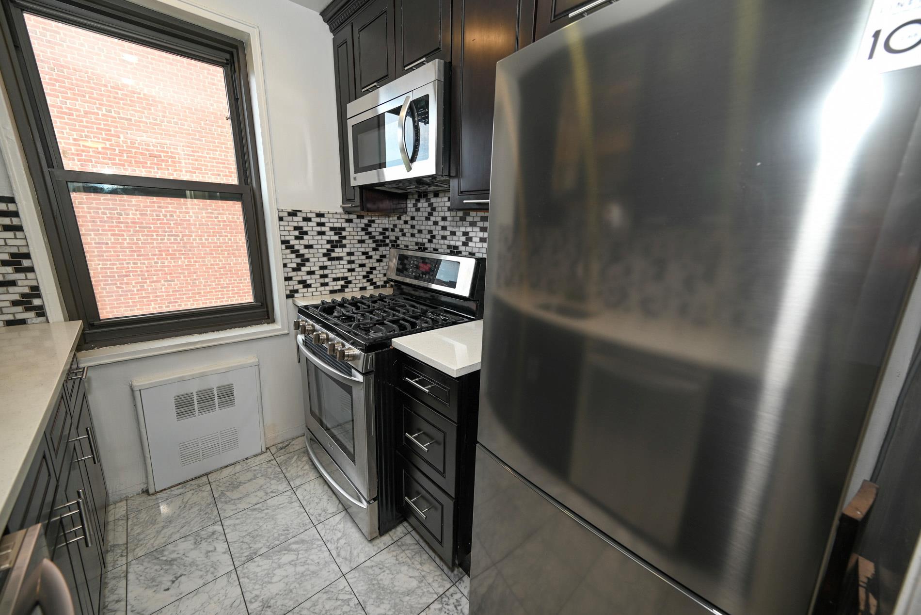 84-01 Main St # 410, Briarwood, NY 11435