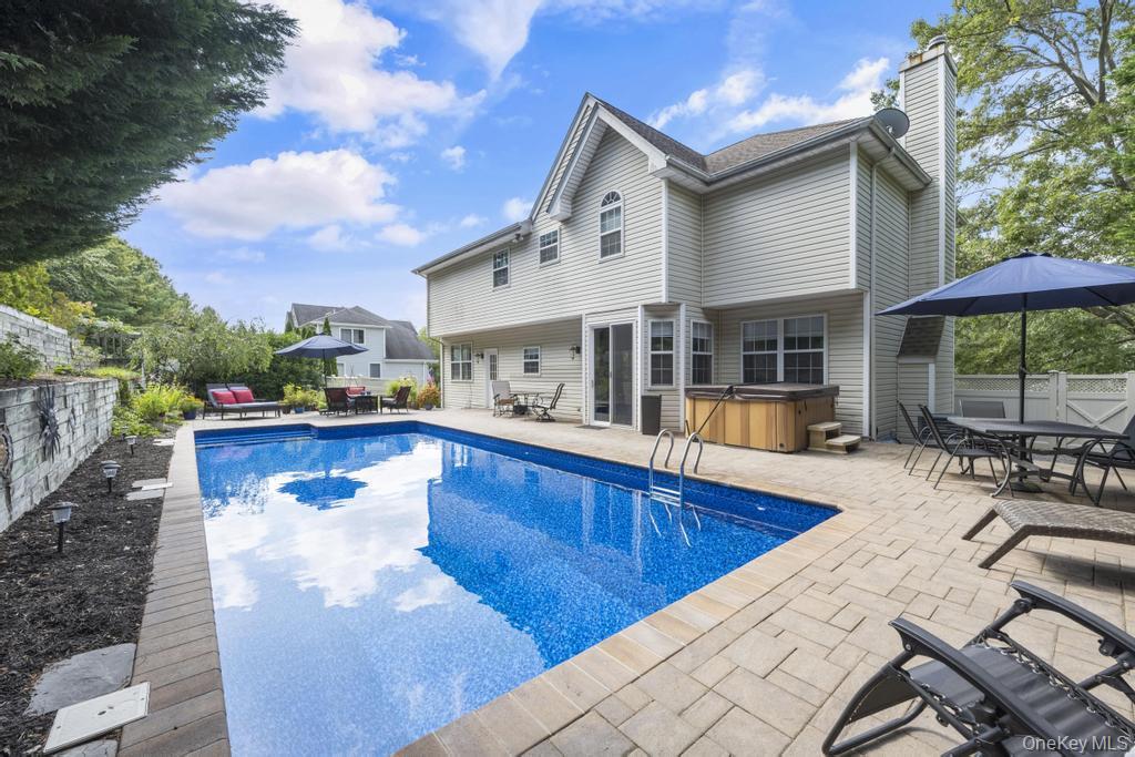 22 Whispering Woods Drive, Smithtown, NY 11787