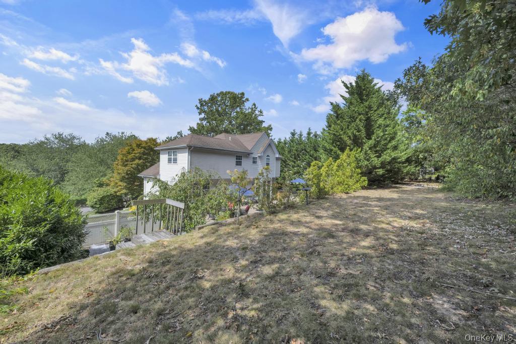 22 Whispering Woods Drive, Smithtown, NY 11787