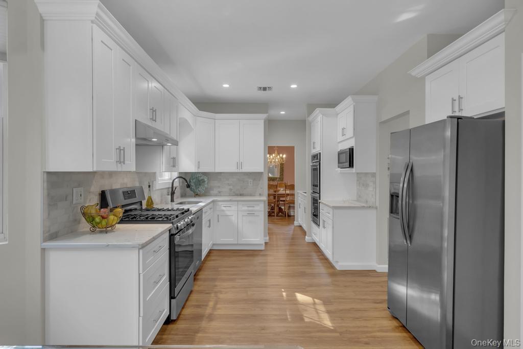 22 Whispering Woods Drive, Smithtown, NY 11787