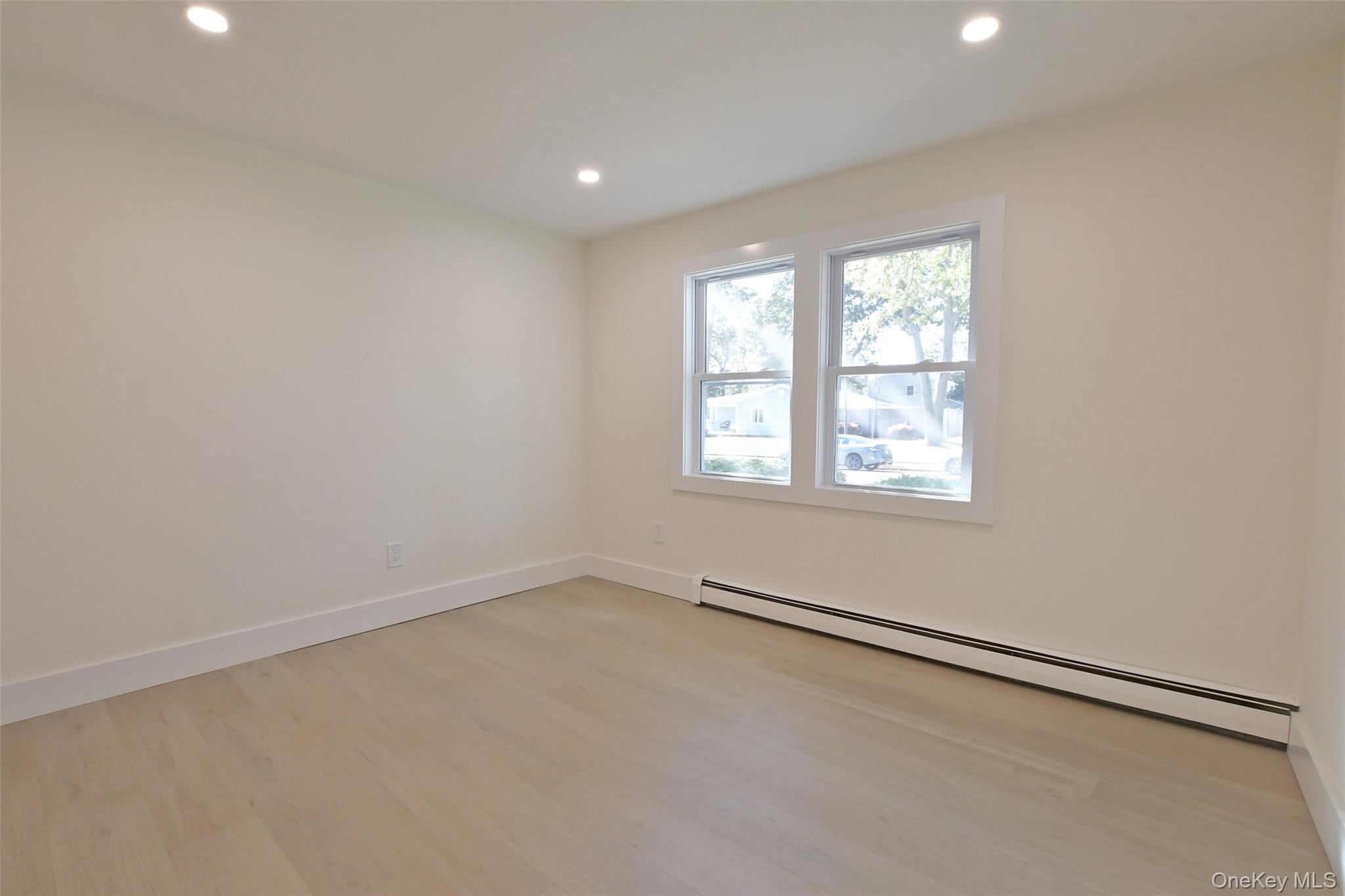 15 Spurwoods Lane, Farmingville, NY 11738